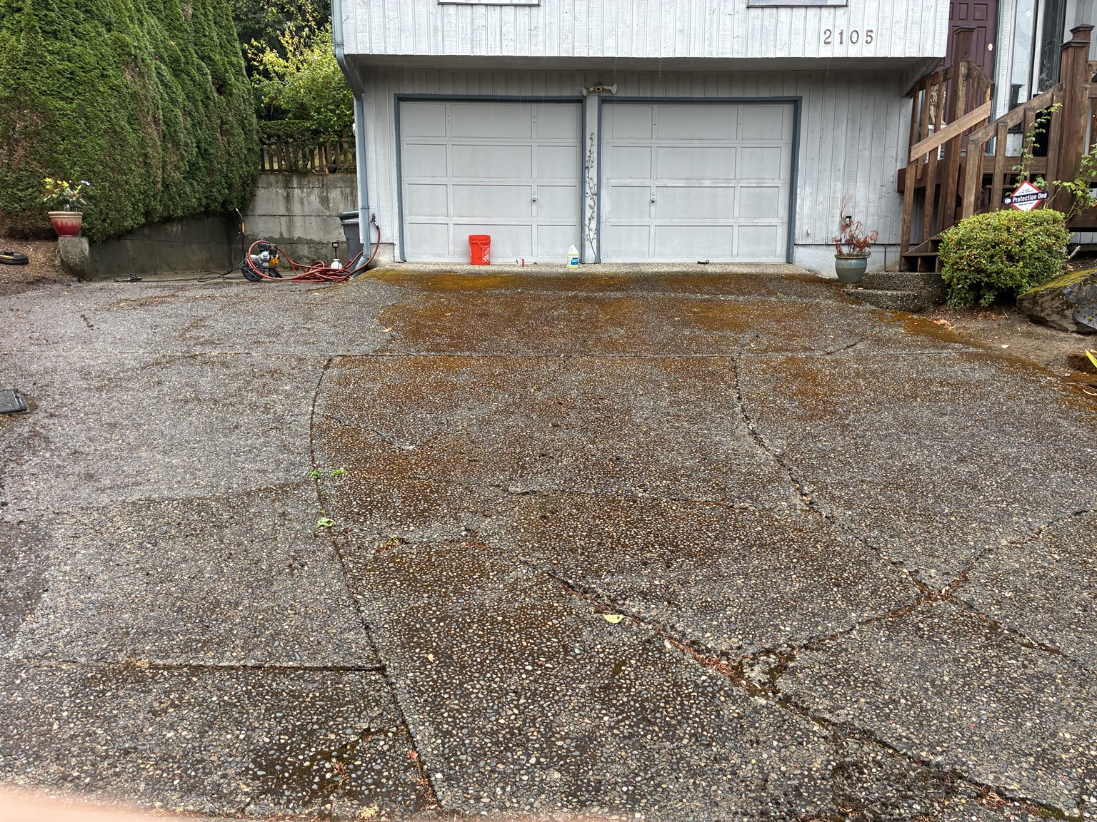 Mossy and dirty driveway before pressure washing